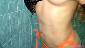 Latina babe masturbates in the bath, reaching orgasm