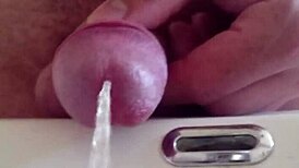 She pisses in the sink, close-up view