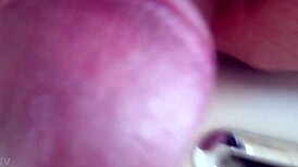 She pisses in the sink, close-up view