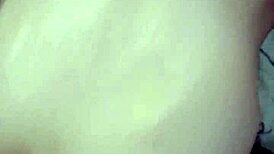 Amateur video with a young woman in an intimate setting.