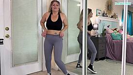 sexy milf tabithaxxx tries on tight gym leggings in bedroom, flashing curvy body and big natural tits for pov fans during sfw haul.