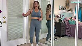 sexy milf tabithaxxx tries on tight gym leggings in bedroom, flashing curvy body and big natural tits for pov fans during sfw haul.