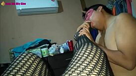 in this scene, a latina milf prostitute in lingerie and high heels gives a footjob with her fishnet clad feet