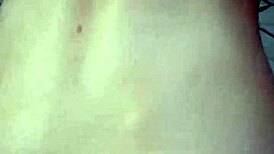 Amateur video with a young woman in an intimate setting.