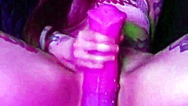 She grips the dildo tightly, clothes ripping as she rides and drips with pleasure.