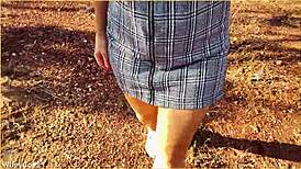 The wife accidentally forgets her panties and flashes her shaved pussy during an upskirt moment in the skirt.