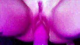 She grips the dildo tightly, clothes ripping as she rides and drips with pleasure.