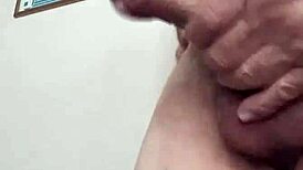 The bear guy jerks off with his huge cock, moaning loudly.