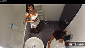 Two pornstars perform softly in the bathroom for voyeurs
