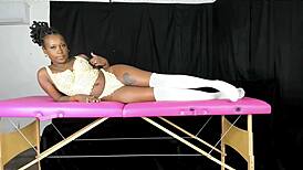 Modeling lace vintage lingerie, she shows off big ebony curves. Retro vibes shine.