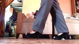 Shemale struts in black high heels, teasing with every bold step