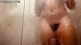 Young Girl Filmed in Shower Exposing Her Hairy Wet Pussy to Camera