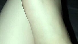 a slut shows her bare feet in the dark