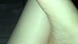 a slut shows her bare feet in the dark