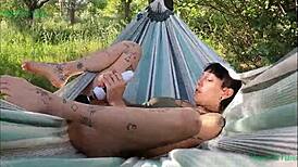 Happy Teen Satisfying Herself In Hammock Outdoors In La Mancha Spain