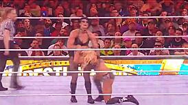 rhea ripley battles charlotte flair in a intense wrestling match at wrestlemania