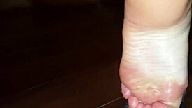 luh gives a footjob with her feet