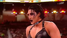 rhea ripley battles charlotte flair in a intense wrestling match at wrestlemania