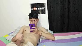 young colombian guy jerks off to spanish porn on his phone, then his stepmom joins in