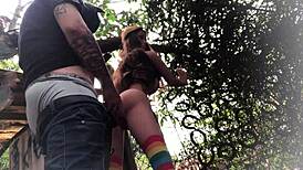 In the backyard, fucking the redhead's ass like a sex toy.