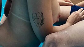 Latina dances at club pool with big tits!