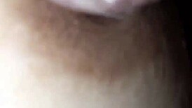 The nipple glistens with saliva on the glans