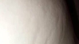 The nipple glistens with saliva on the glans