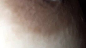 The nipple glistens with saliva on the glans