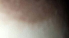 The nipple glistens with saliva on the glans