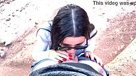 She performs deep blowjob in beautiful canyon with glasses