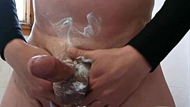 Shaving leads to unexpected cum in this intriguing scene.