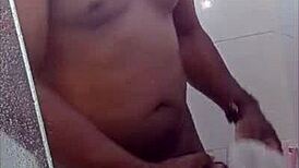 Black guy casually rubs his huge cock outdoors in public