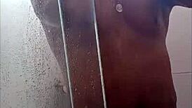 Black guy casually rubs his huge cock outdoors in public