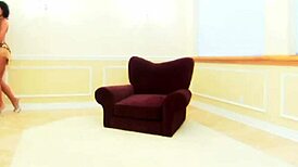 Brunette bimbo with huge fake boobs gets pounded in vintage armchair