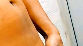 Shemale sissy pisses on her own body in humiliation