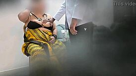 doctor examines patient in clinic setting