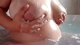 hey, check her out... washing those milky pregnant breasts in the bathtub! 😍