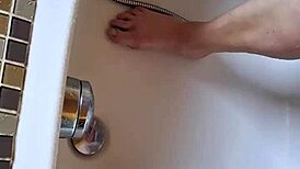 washing dirty feet in the bathtub