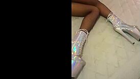 I am wearing total silver and fishnet pantyhose with beautiful ankle boots and very high heels.