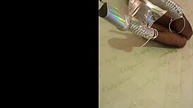 I am wearing total silver and fishnet pantyhose with beautiful ankle boots and very high heels.