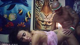 Behind scenes, slim brunette babe in glasses sucks dick and gets fucked doggystyle!