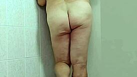 trans woman in crossdressing shows off barefoot feet and sexy ass