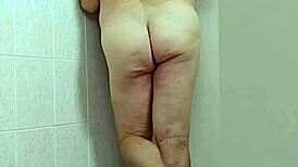 trans woman in crossdressing shows off barefoot feet and sexy ass