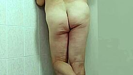 trans woman in crossdressing shows off barefoot feet and sexy ass