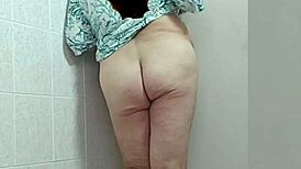 trans woman in crossdressing shows off barefoot feet and sexy ass