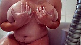 busty teen washes and massages her soapy big tits