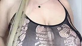 milf in see-through clothes caresses her big natural tits