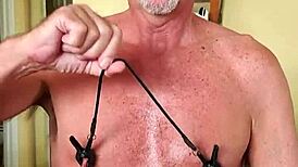 Pervy guy's nipples are wired to his cock for arousal