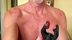 Pervy guy's nipples are wired to his cock for arousal