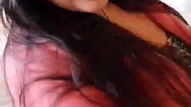 Amateur girl does striptease in bath, ripping clothes to show small tits.